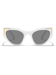 Detail of white cat eye sunglasses featuring gold metal accents and gray lenses