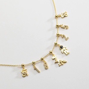 Gold-plated S925 silver bracelet featuring cubic zirconia charms and astronaut pendant
