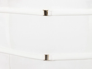 Detail of white woven dress showing thin straps with elegant gold metal buckles