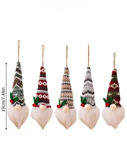 Detailed view of five knitted Christmas gnomes with white beards and festive hat patterns