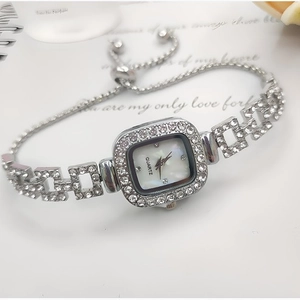 Detail of square silver watch with rhinestone chain and adjustable drawstring clasp