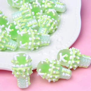 Close-up of green and white ice cream cone acrylic beads for DIY jewelry making