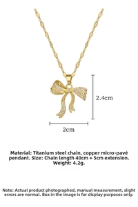 Detailed size specifications of a gold bow pendant necklace with zircon micro-paving