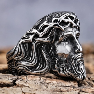 Macro shot of vintage silver stainless steel ring featuring Jesus with crown of thorns detail