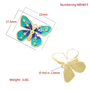 Colorful butterfly pendant with blue-green enamel and 22mm x 17.5mm dimensions