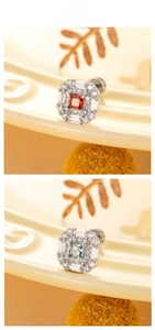 Detailed tile display of titanium steel stud earrings with red and blue zircon stones