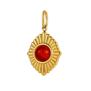 Detailed shot of a gold-plated stainless steel pendant with a central red natural stone