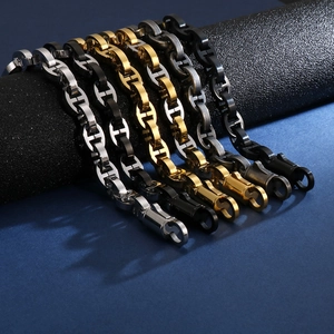 Detail view of four colors of geometric H-link bracelets on display props