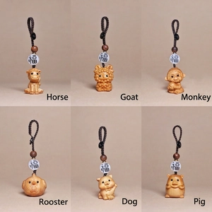 Carved wood zodiac keychains featuring horse, goat, monkey and rooster with fortune beads