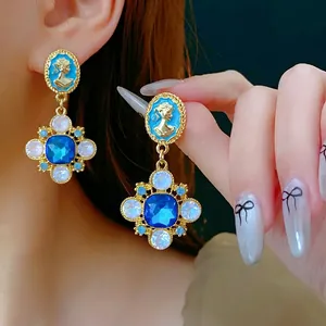 Vintage gold cameo earrings with blue sapphire drop crystals for elegant women