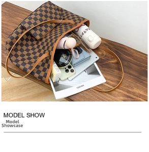 Detail view of large checkered tote bag showing high capacity for daily essentials