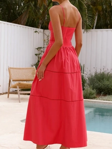 Red tiered maxi dress with elastic smocking and eyelet details, back view poolside