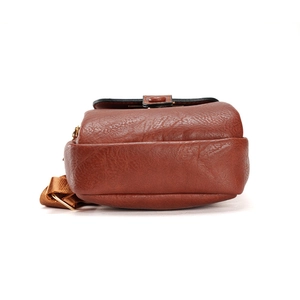 Vintage brown leather backpack with gold metal hardware and durable nylon strap detail