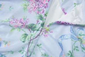 Close-up of invisible zipper and floral mesh fabric on summer backless dress