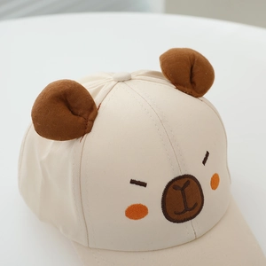 Detail of beige kids baseball cap with 3D ears and cartoon bear face embroidery