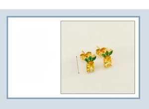 Detail showing 18K gold plated stainless steel pineapple studs with vibrant zircons