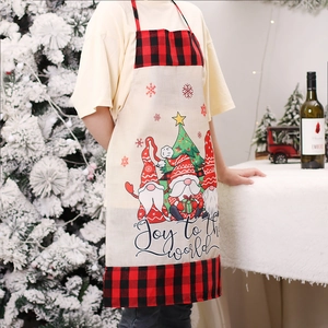 Christmas burlap apron with gnome design and red-black plaid trim for holiday cooking