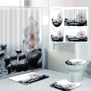 Zen style bathroom set with orchid and pebble print polyester shower curtain and mats