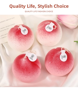 Detailed view of four peach shaped scented candles with realistic frosted texture