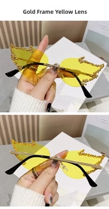Detail of yellow flame-shaped rimless sunglasses with rhinestone accents and gold frame