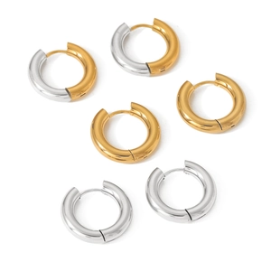 Three pairs of gold and silver stainless steel hoop earrings on a white background
