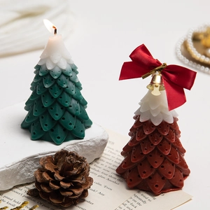 Christmas tree scented candles in green and red colors for festive home decor and gifts