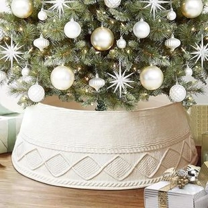 Macro shot of cream knit tree collar featuring intricate woven texture and festive style