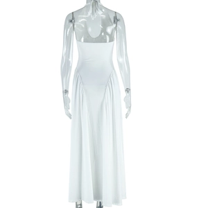Detailed view of backless halter design on white sleeveless maxi dress for women