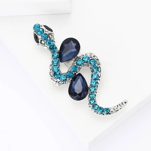 Vintage snake brooch in silver alloy with light blue crystals and dark blue gemstones