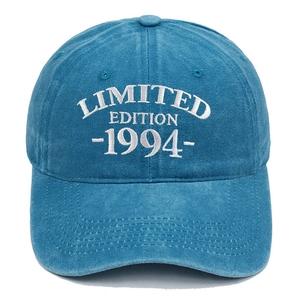 Detail of white LIMITED EDITION 1994 embroidery on a vintage blue washed baseball cap