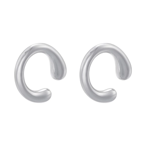 Close-up of polished silver C-shaped ear cuffs with high-gloss mirror finish and modern style