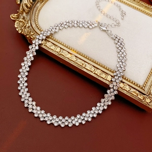 Macro detail of silver rhinestone choker necklace featuring double row crystal design