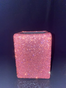Close-up of a rectangular pink rhinestone storage holder with sparkling diamond finish