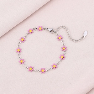 Detail of pink enamel daisy charms on a stainless steel chain with lobster clasp