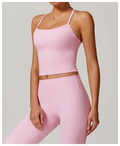 Pink yoga set detail featuring fine straps sports bra and high-waist fitness leggings
