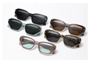 Detailed top view of trendy geometric sunglasses in black, green, and tortoiseshell colors