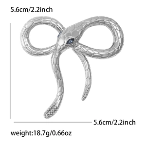 Detail view of silver snake brooch with blue gem eyes and dimensions 5.6cm and 18.7g