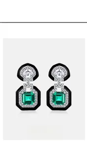 Detailed view of Art Deco emerald geometric earrings with black enamel and S925 silver