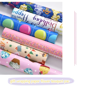 Detail of colorful birthday gift wrapping paper with cartoon letters and festive patterns