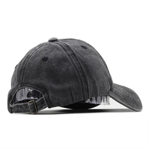 Detail of washed grey baseball cap with adjustable metal buckle and cotton texture