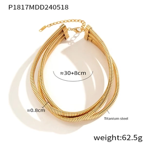 Detail view of gold titanium steel layered snake bone chain necklace with polished finish