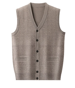 Macro detail of the brown V-neck knitted vest showing fine check pattern and button texture