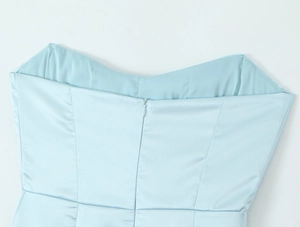 Detailed view of light blue satin dress featuring a seamless concealed zipper closure