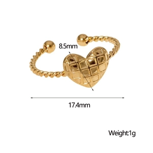 Macro detail of gold heart-shaped quilted earring with dimensions 8.5mm by 17.4mm
