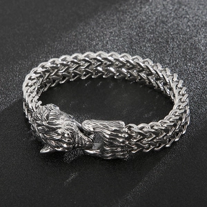 Close-up of Viking wolf head clasp and braided stainless steel chain bracelet