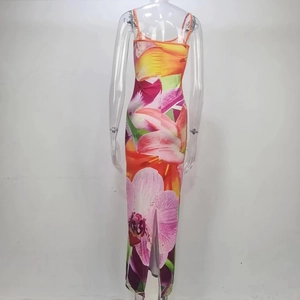 Detail showing backless slit design and vibrant floral print on slim fit dress
