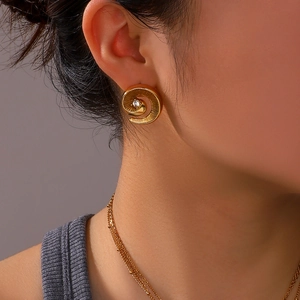 Golden spiral conch pendant set with white zircon and layered thin gold chain