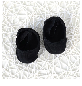 Detail of black cotton lace baby socks with elastic strap on white mesh background