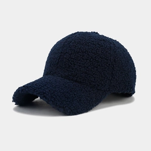 Detailed close-up showing the soft fleece texture of the navy blue baseball cap