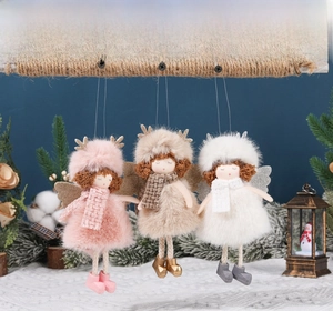 Detail of plush Christmas angel ornaments with plaid scarves and sparkling wings